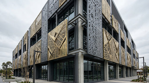 Laser-cut metal architectural facade panels and geometric screen cladding on building